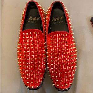 Red spike loafers
